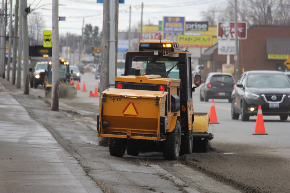 The sand sept off the sidewalk onto the road. Jeff Turl/Bay