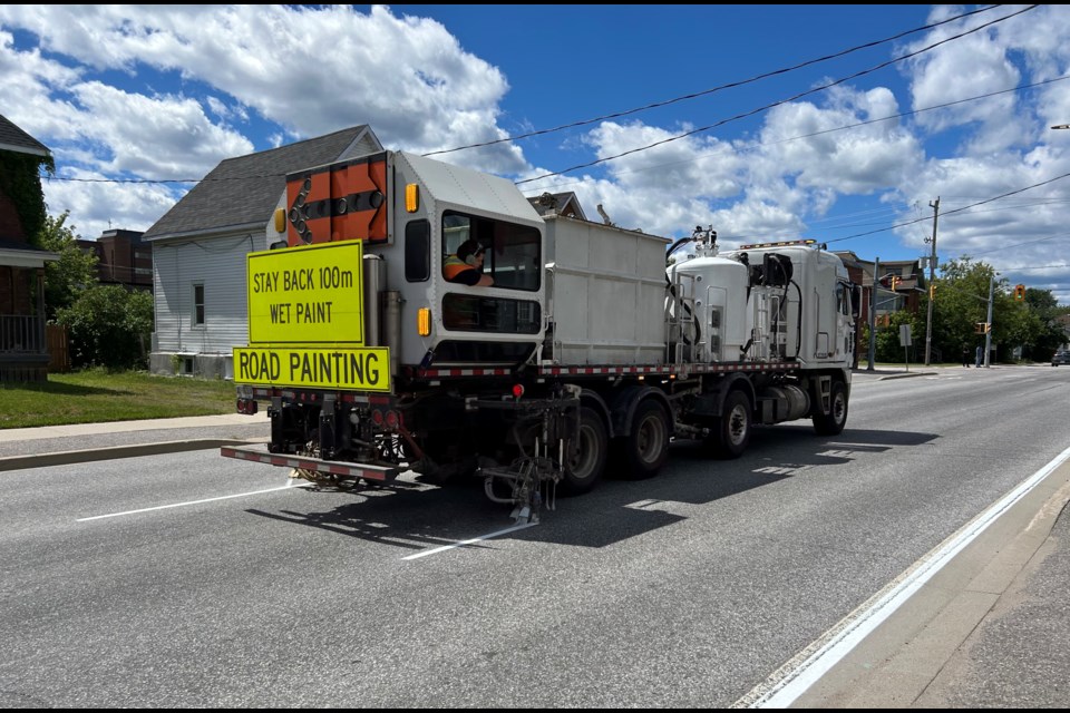 A line painting truck heads down McIntyre St. in North Bay.