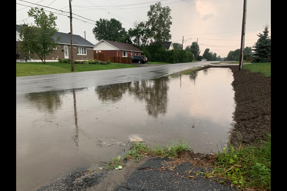 Overflowing culvert on Aberdeen Avenue in a neighbourhood that city crews just repaired the ditches. Photo by Chris Dawson/BayToday. 