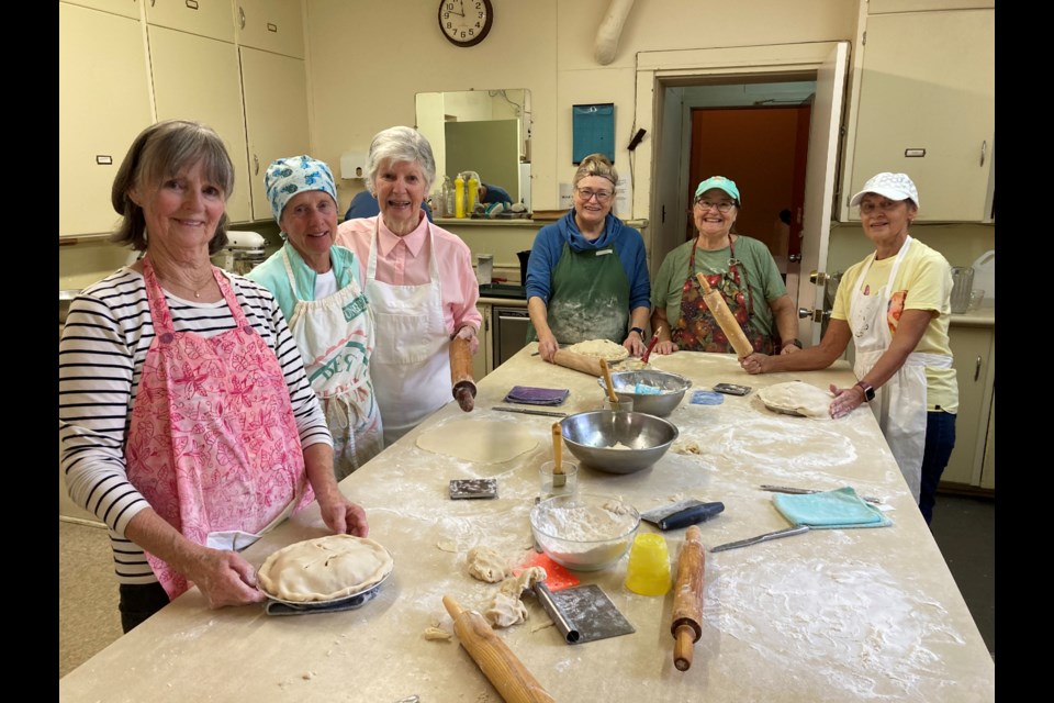 It takes many volunteers to make over 1,000 apple pies 