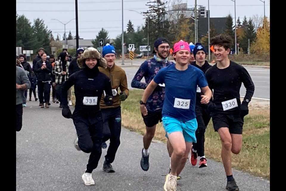 Light snowflakes followed participants in the 5th Annual Conquer the Escarpment Shelby Dickey Memorial Fun Run/Walk got underway