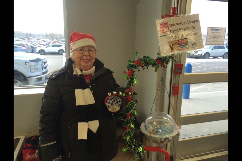 Mary Marrs volunteers at a Salvation Christmas Army Kettle. Money raised is used for its community programs and services