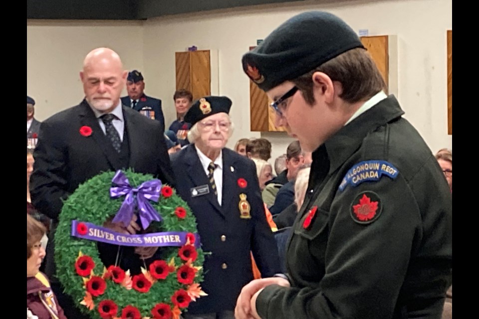 Silver Cross Mother Sylvia Gagnon     escorted by son at wreath-laying ceremony 