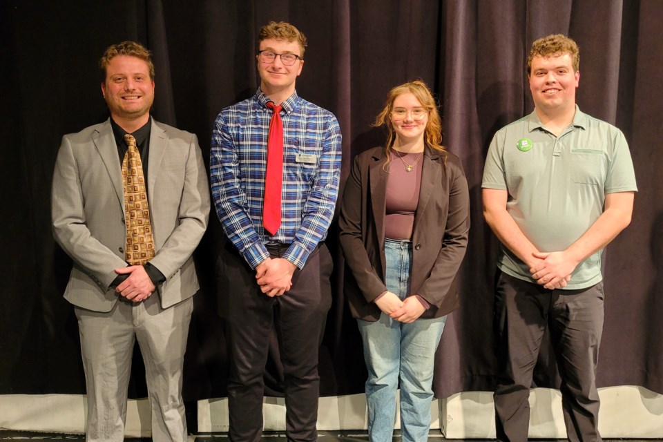 After the debate, NDP candidate Loren Mick (left) and Green Party candidate Colton Chaput (right) pose for a photo with event organizers Tyler Clarkson, who also moderated the event, and time-keeper extraordinaire, Vanessa Beaudry 