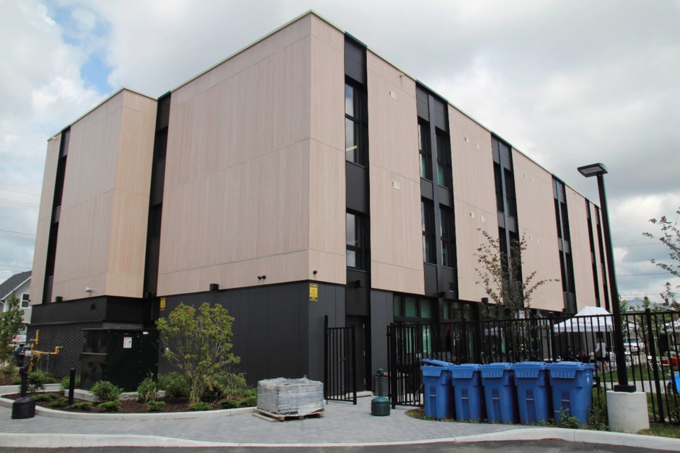 A view of the building from behind. There are windows at each end of the upper halls facing East and West, so as to acknowledge the sunrises and sunsets.