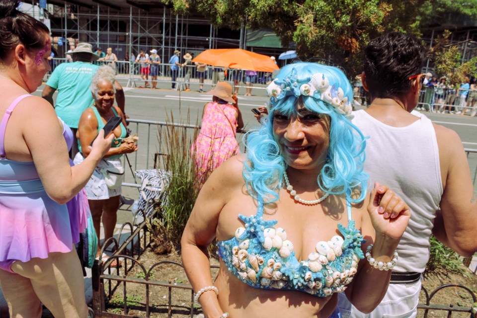 Mermaid Parade attendee poses in homemade costume.