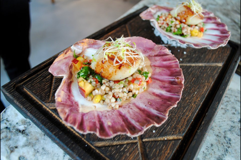 Pan-seared scallops with a buckwheat peach salad.