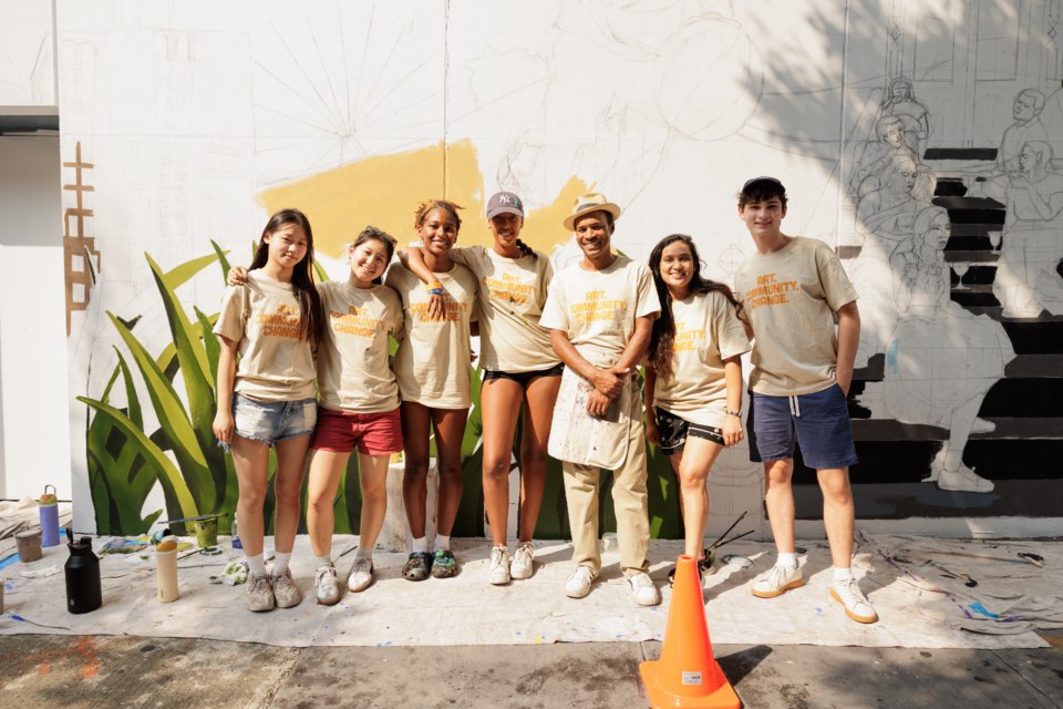 Groundswell Artist Carlos Mateu (third from right) alongside Groundswell youth artists who developed the vision for the mural.