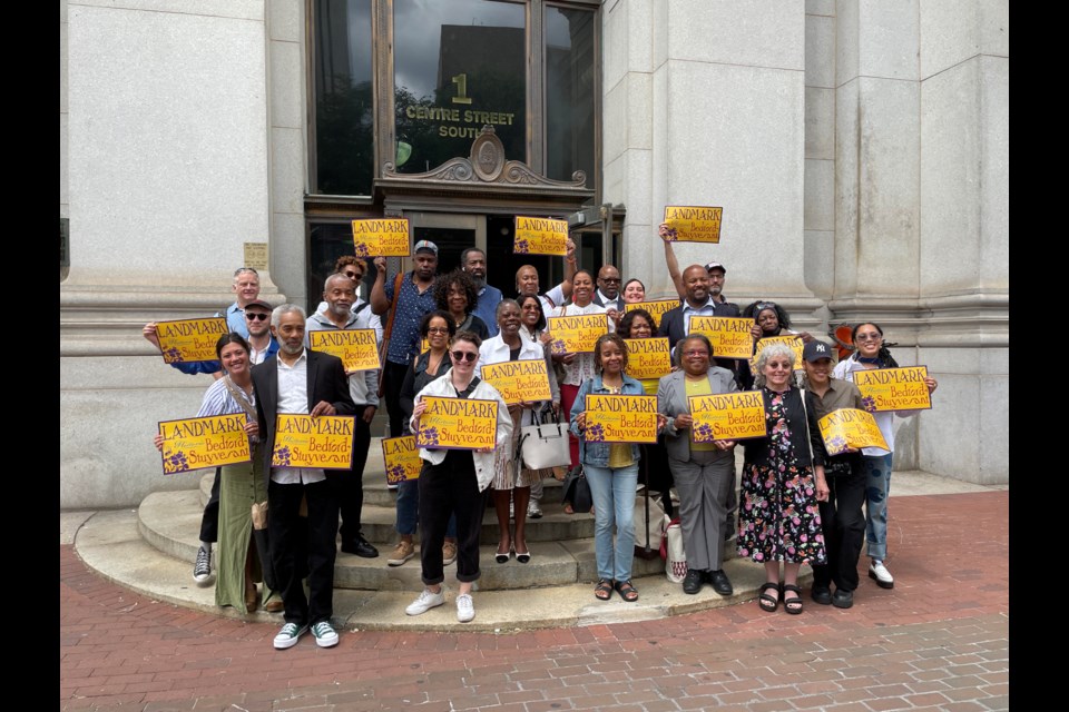 Advocates for landmarking the Willoughby-Hart Historic District following the LPC hearing.