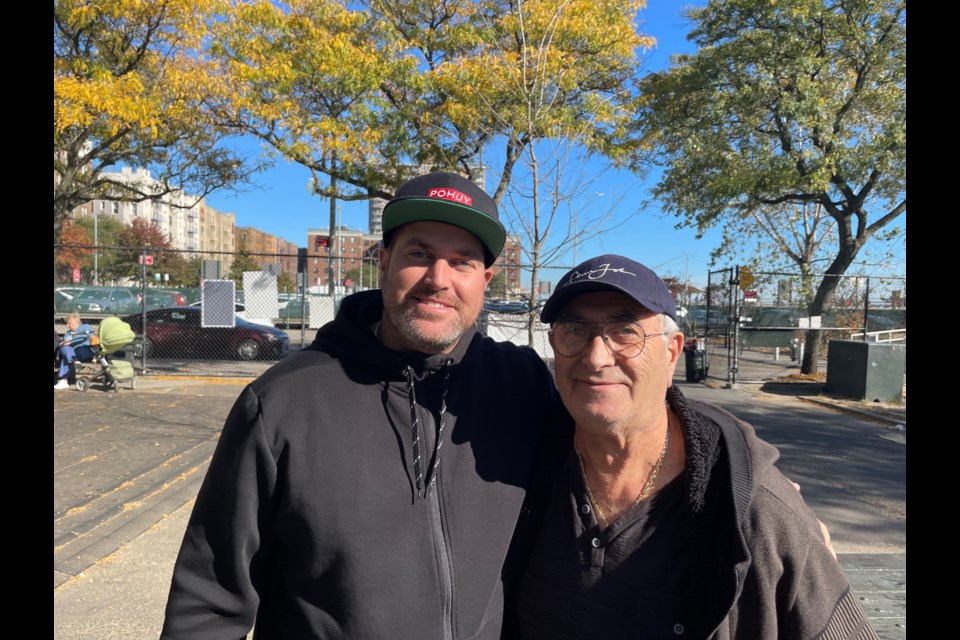 U.S.-born Vincent Kasanov poses with his father, Jacob Kasanov, who left the former Soviet Union in the 1970s for Brighton Beach.