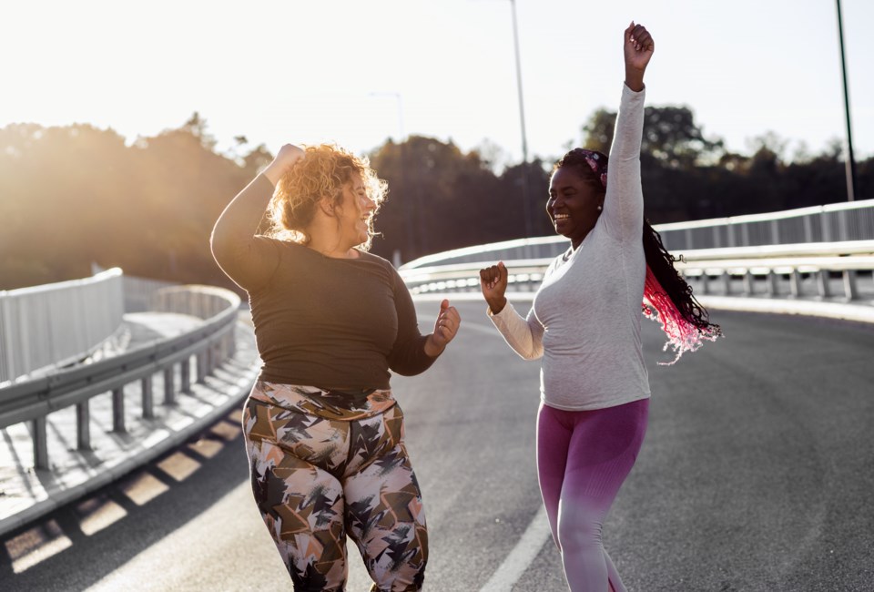 two-excited-young-plus-size-women-jogging-together-2023-11-27-05-30-38-utc