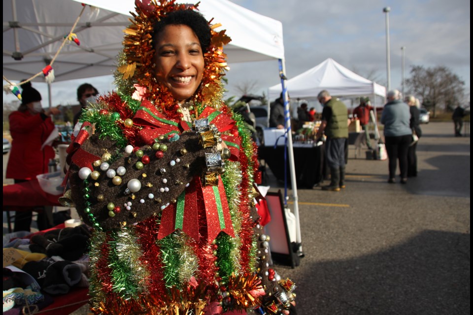 Paige Walters, 34, wears her Christmas party award-winning gear at Bradford's Outdoor Christmas Market on Dec. 11. 