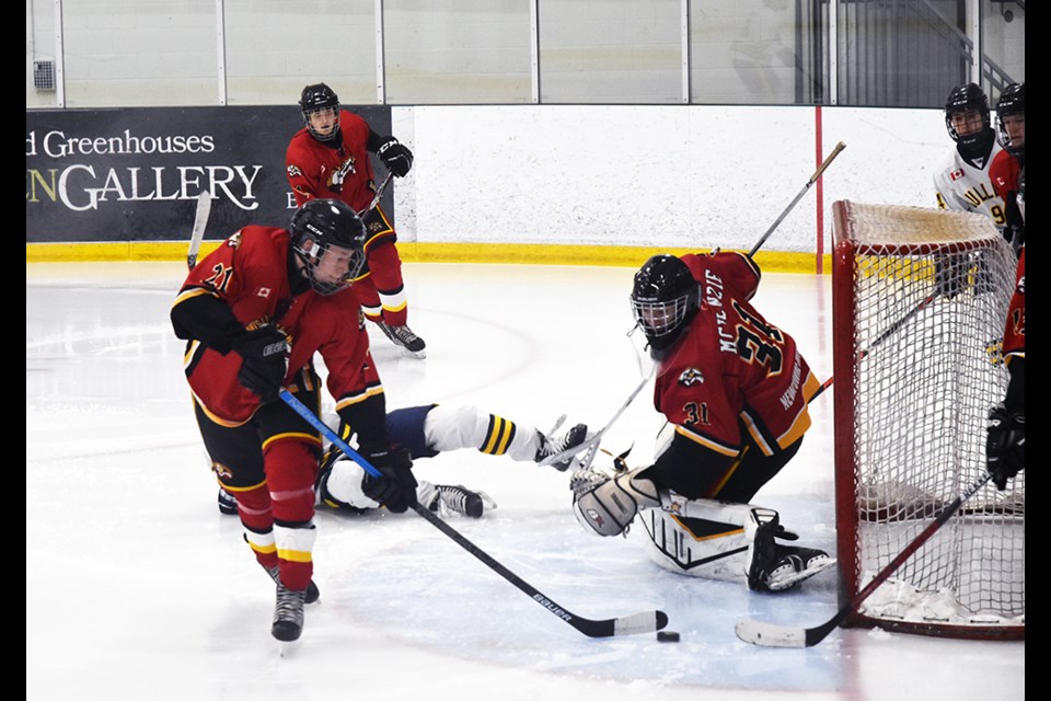 Innisfil defenders quick to move the puck away from the Winterhawk net. Miriam King/Bradford Today