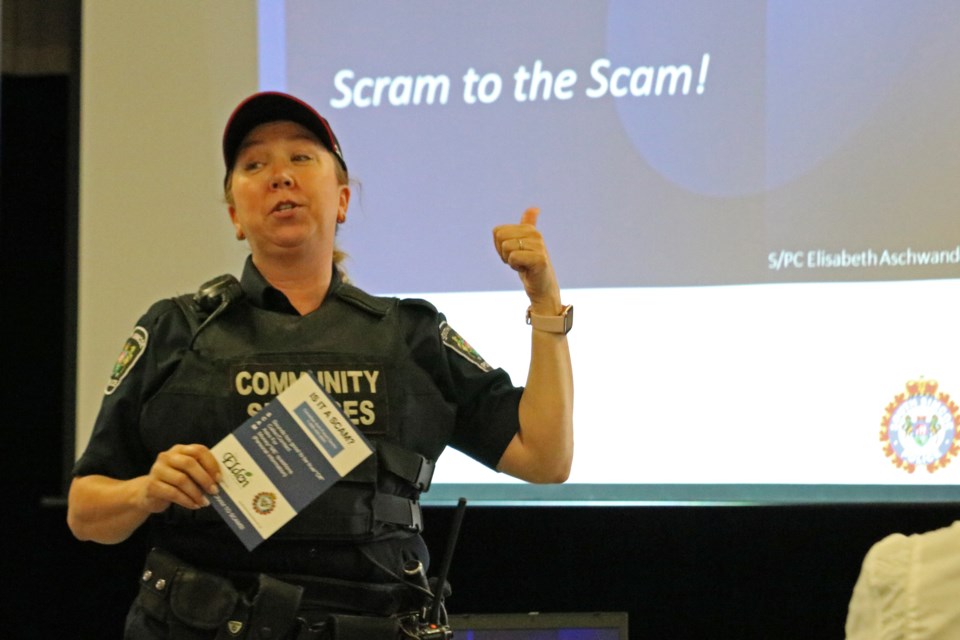 In this file photo, Special Const. Elisabeth Aschwanden of the South Simcoe Police Service gives a presentation on how to protect yourself from scams, during the Seniors Health and Wellness Fair, at the Danube Seniors Leisure Centre in Bradford.