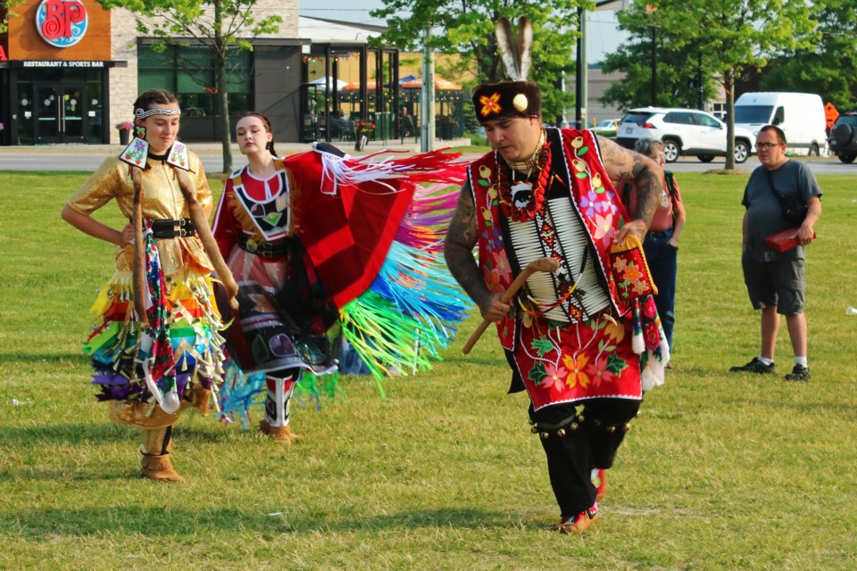 Alexa, Kayla and Sonny Robbins demonstrate three different types of traditional dance at once, during the town’s celebration of National Indigenous Peoples Day at the Bradford West Gwillimbury Public Library lawn in June 2023.