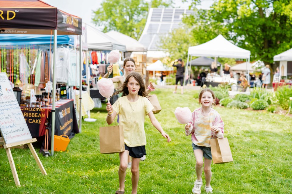 Kids enjoy some cotton candy at the 2023 Spring Market at Fermanagh Farms.