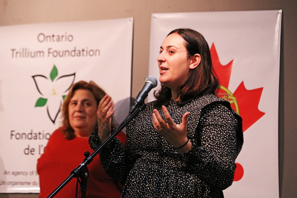 Elizabeth Lambert, treasurer of the Portuguese Cultural Centre of Bradford (left), listens as Christin Perdiz, vice-secretary of the centre speaks during the presentation of a $150,000 grant to the centre from the Ontario Trillium Foundation.