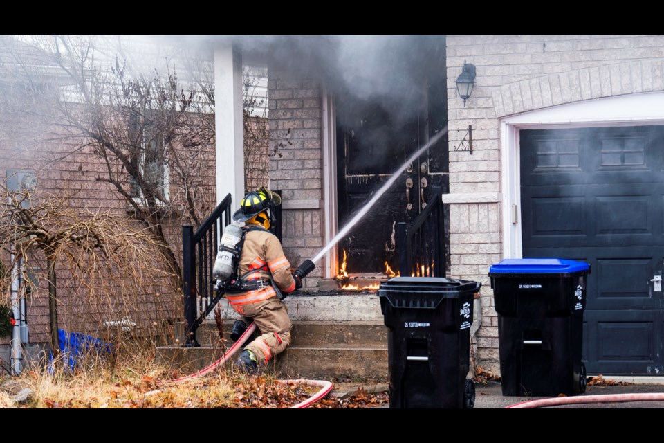 Upon arrival Bradford firefighters were met by flames at the front door of a house fire on Longview Drive Dec. 18. | Paul Novosad for BradfordToday