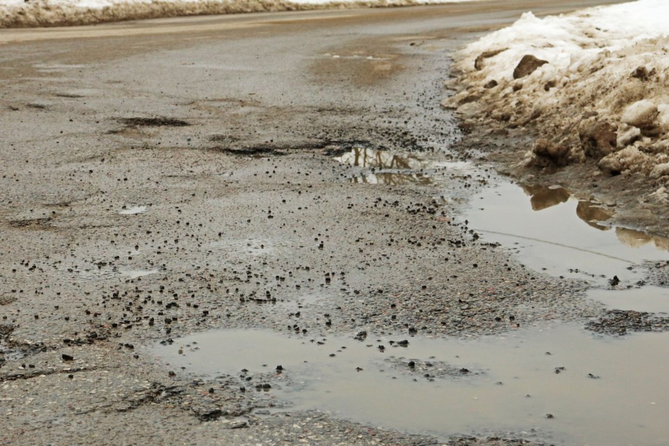 Pot holes are seen filled with water on Wednesday, Feb. 21.