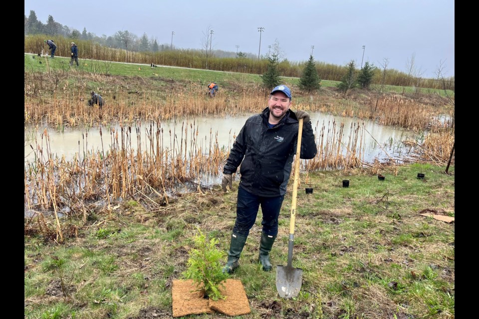 Ward 2 Coun. Jonathan Scott, who also chairs the green initiatives advisory committee, is seen in an undated photo planting trees near Henderson Park in Bradford.