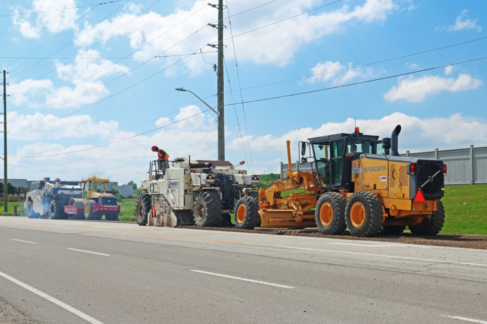 Crews work on the north side of Line 8, west of Langford Boulevard, as part of Bradford’s project to resurface and reinforce Line 8 between County Road 4 (Yonge Street) and Sideroad 10, as well as Sideroad 10 between Line 8 and Reagens Industrial Parkway, on Tuesday, May 21.