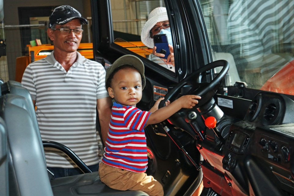 Francis, 17 months, explores a Kubota while his grandparents watch during the town’s third-annual Touch A Truck event at the Urban Operations Centre Wednesday evening, May 22.