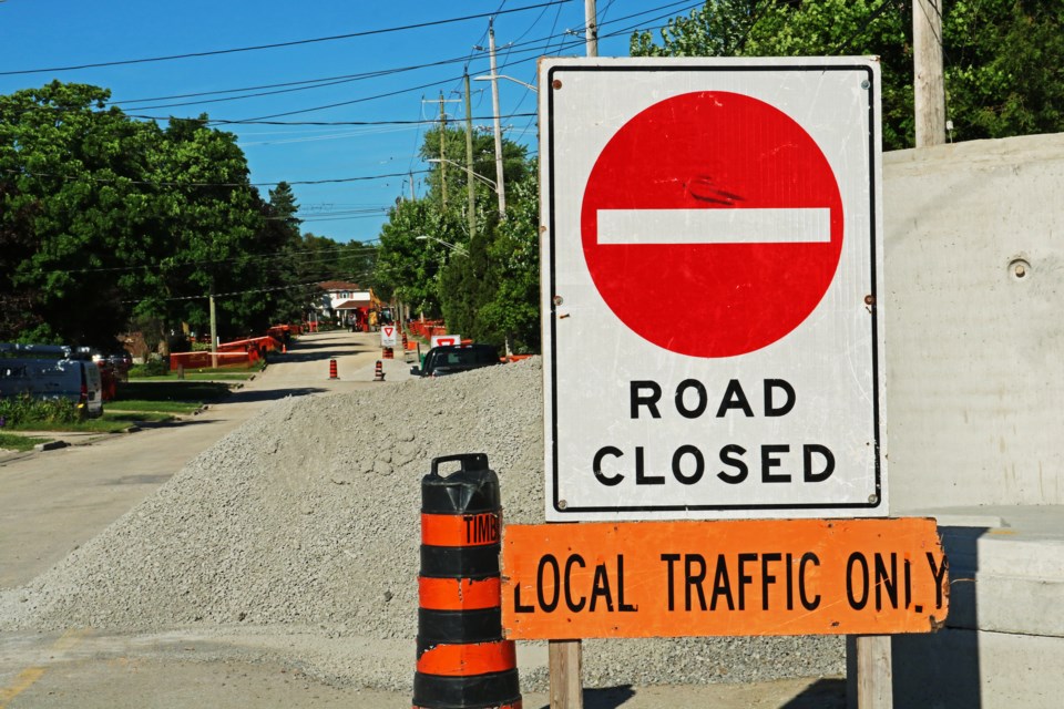 Signs warn motorists of construction as part of a watermain replacement on Agar Avenue in Bradford.