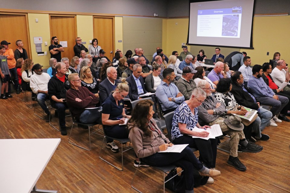 About 70 people (some out of frame) packed council chambers at the Bradford West Gwillimbury Public Library to share concerns about a proposed development for the Bradford Highlands Golf Club, during a public planning meeting on June 11.