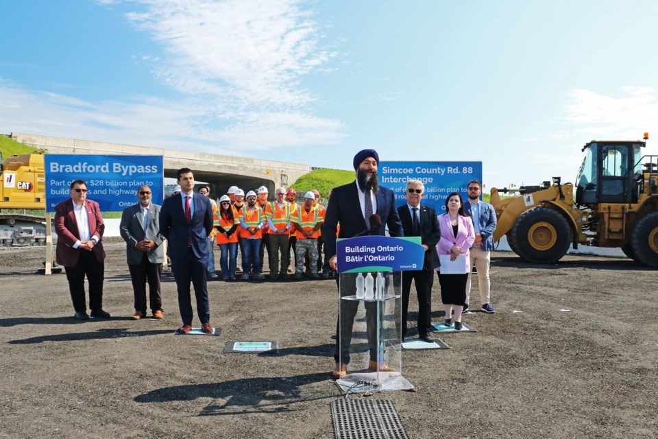 Joined by members of Bradford council and representatives from the construction industry, Minister of Transportation Prabmeet Sarkaria announced the province has awarded a $91-million contract to Dufferin Construction for the replacement of the bridge and interchange at Highway 400 and County Road 88, at a construction site near the area carpool lot in Bradford on Wednesday morning, July 17.