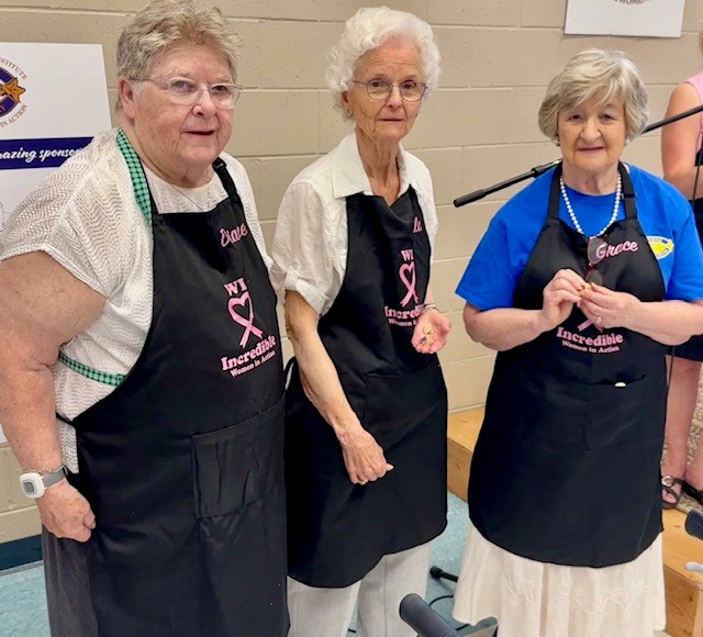 Members of the BHWI receiving long-service pins: Dianne Van Voorst for 40 years, Leila Lloyd for 60 years and Grace Elliott for 60 years.