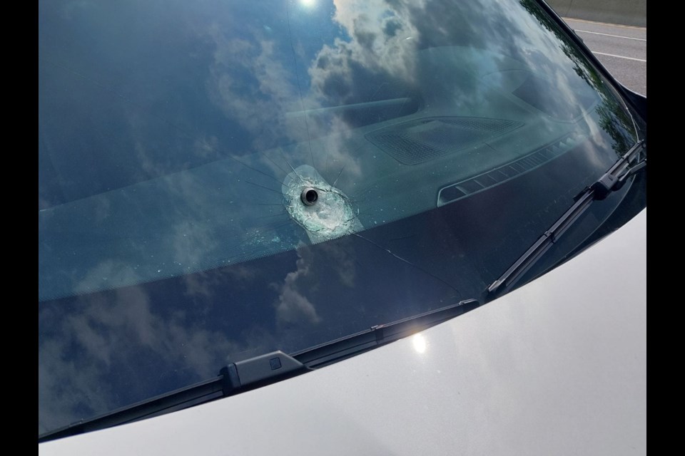 A nut shown embedded in a windshield after wheel parts came off a recently repaired vehicle near the interchange at highways 400 and 88 in Bradford July 25. 