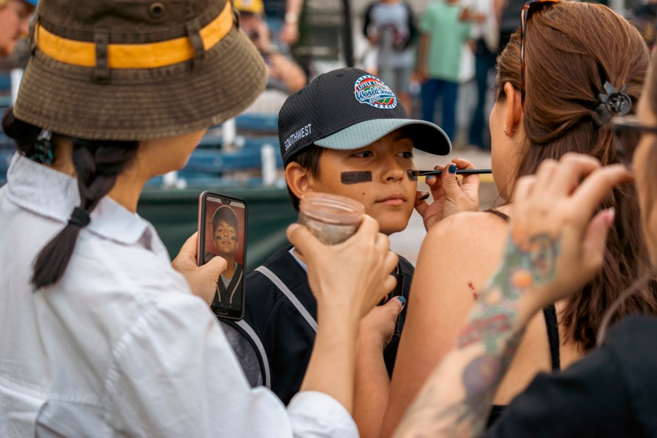 Makeup artists prepare Jacob Mazeral to appear as Mikey Valdez on the set of the feature film ‘You Gotta Believe’.