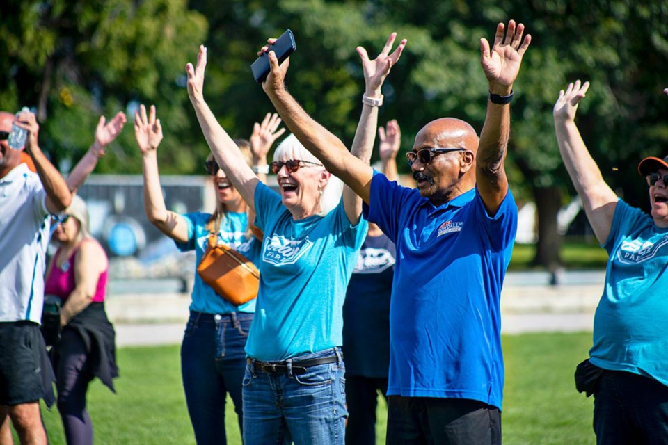 Participants get their blood pumping as part of the warm up before the Grand Parade charity walk in Alliston in 2023.