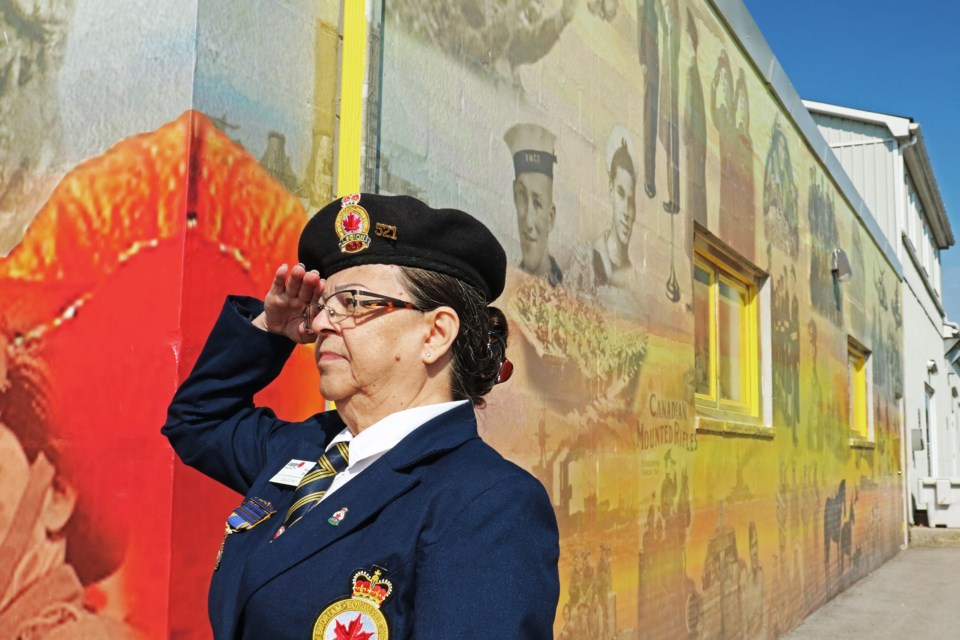 Legion president Wendy Lang salutes during the unveiling of a new mural on the east wall of Bradford’s Bradford’s Royal Canadian Legion Branch 521 at 115 Back St. on Sept. 22, 2024.