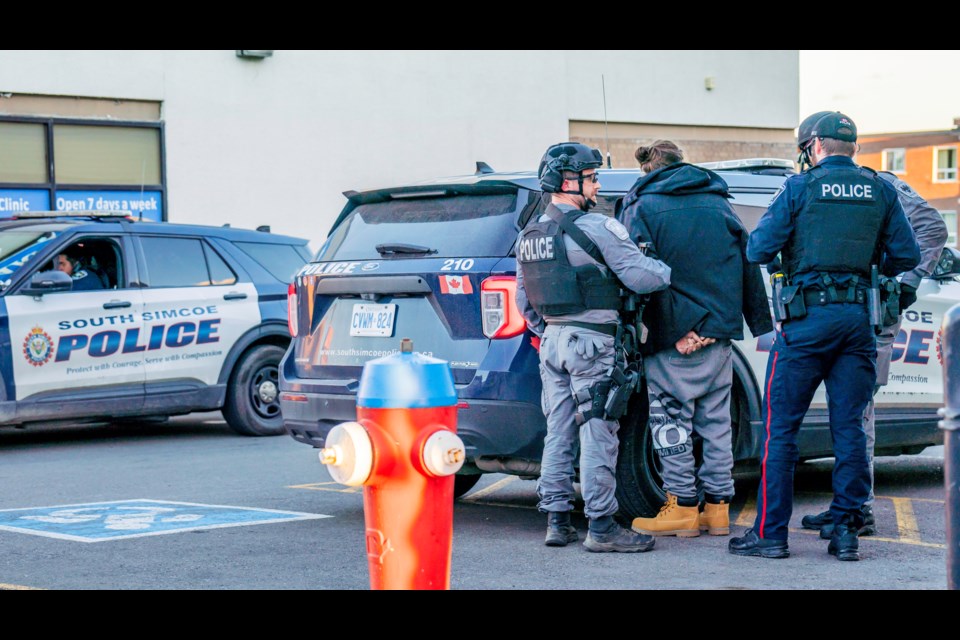 South Simcoe police arrest a suspect after executing a search warrant at an address on Holland Street East in Bradford Oct. 7. 