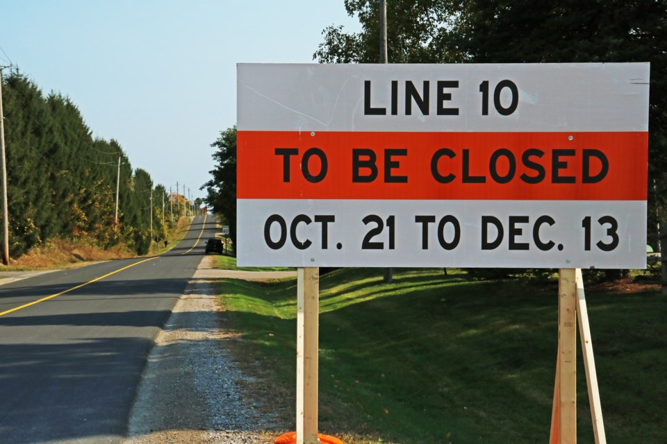 A sign along Line 10 near the intersection with Sideroad 10 warns drivers of the upcoming closure of County Road 4 from Oct. 21 to Dec. 13.