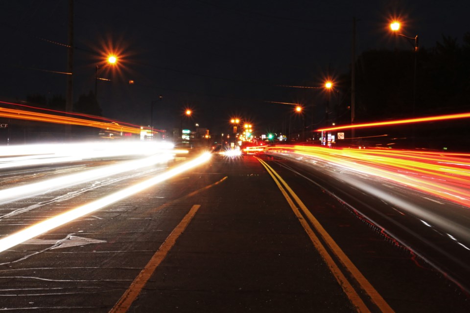 Traffic zips along Holland Street West in Bradford on Oct. 18.