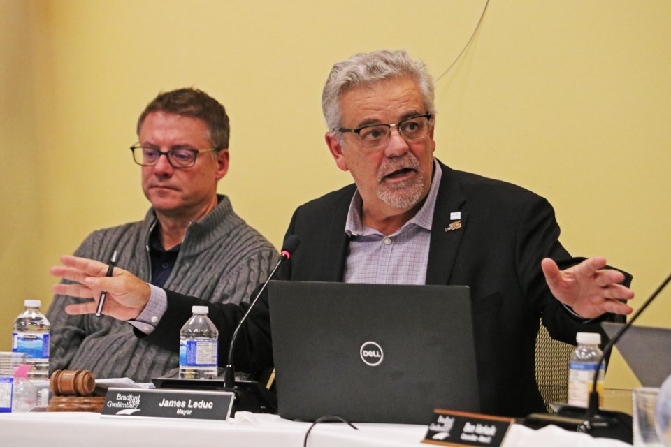 From left: Town CAO Geoff McKnight listens as Mayor James Leduc speaks during budget deliberations at the Bradford West Gwillimbury Public Library on Nov. 13.