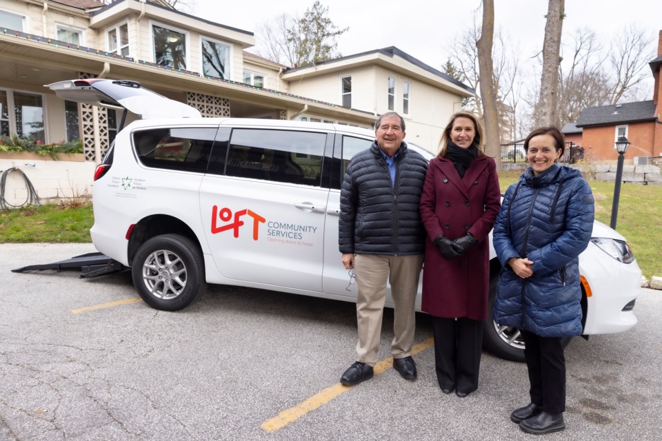 From left: Marv Chantler of the Ontario Trillium Foundation (OTF), York-Simcoe MPP Caroline Mulroney, and Heather McDonald CEO of LOFT Community Services reveal the new accessible van LOFT was able to purchase with a $91,700 grant from OTF, outside Bradford House on Nov. 29.