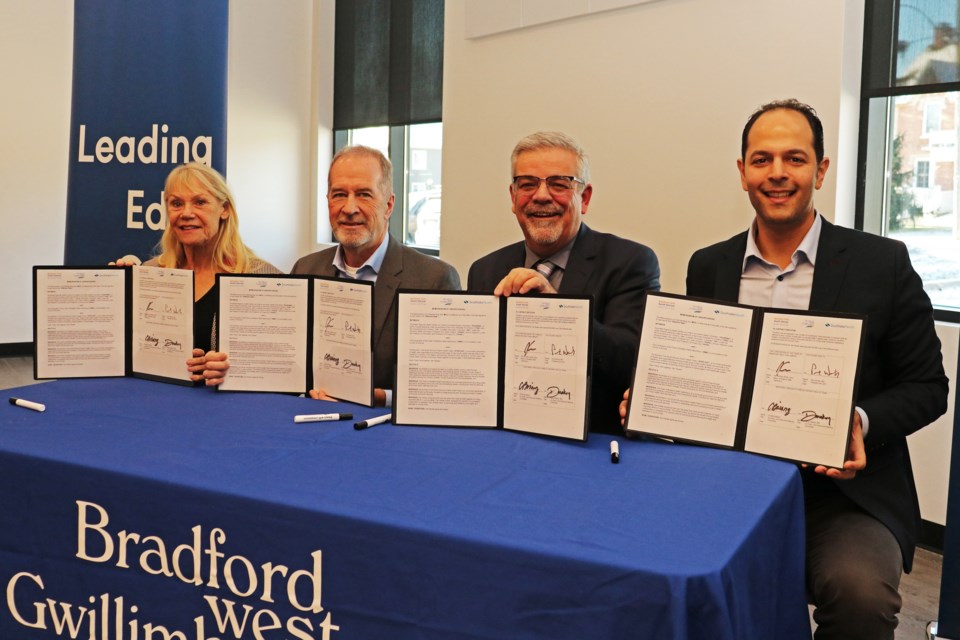 Representatives from Bradford council, Southlake Health and Northern York South Simcoe Ontario Health Team (NYSSOHT) signed of a memorandum of understanding between the three parties for health-care services in town at 177 Church St. in Bradford, on Dec. 13.
From left: Christina Bisanz, co-chair of the NYSSOHT; Paul Woods, doctor, president and chief executive officer at Southlake; Mayor James Leduc; David Makary, doctor, vice-president of medical affairs at the hospital and co-chair of the NYSSOHT.