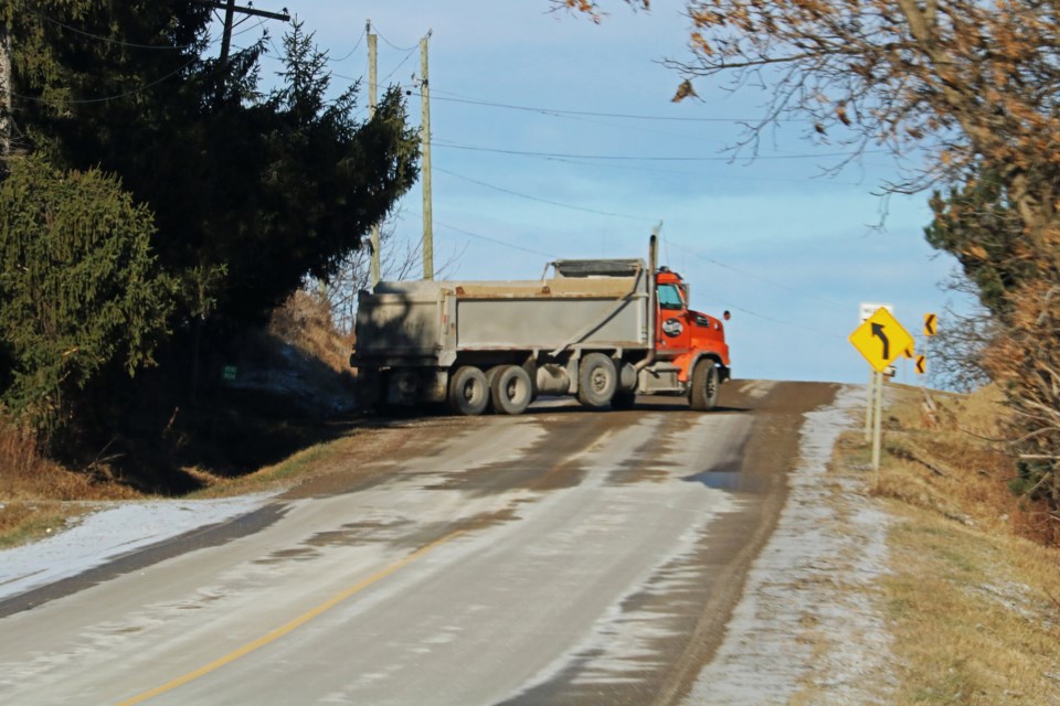 A truck moves materials to and from Sarjeant Co’s future location at 1934 Sideroad 5 in Bradford on Dec. 13, 2024.