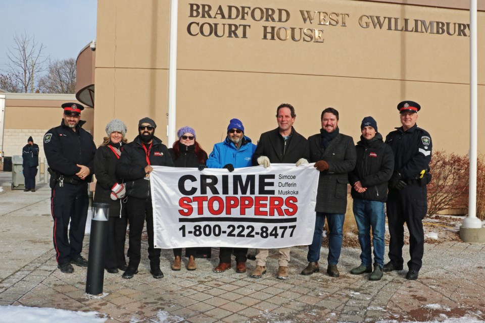 Deputy Mayor Raj Sandhu was joined by members of council, Crime Stoppers of Simcoe Dufferin Muskoka, the South Simcoe Police Service and MP Scot Davidson for a flag-raising ceremony recognizing January as Crime Stoppers month in town, outside the Bradford West Gwillimbury Court House on Jan. 9.