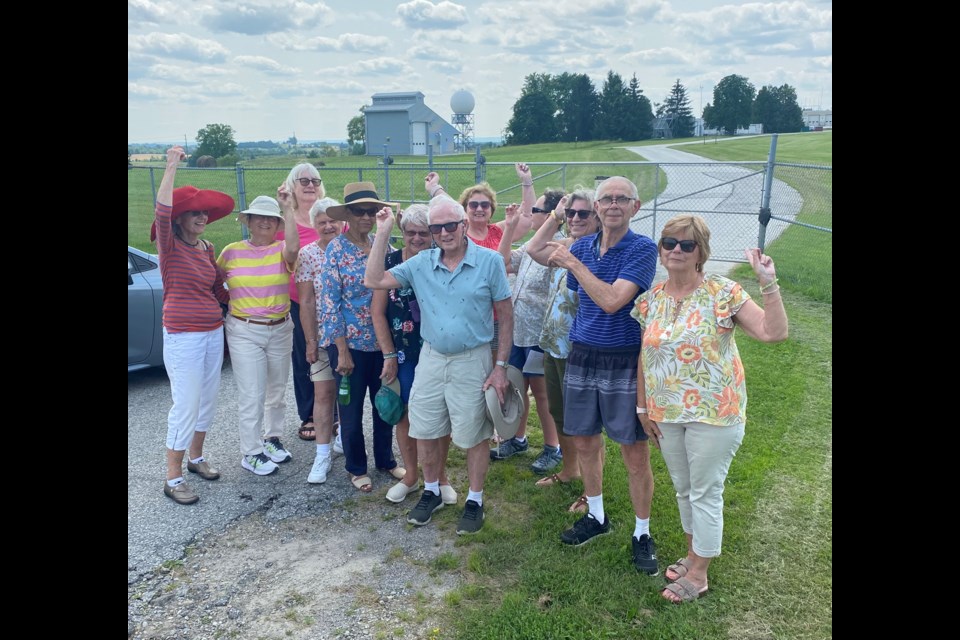 Franz Aschwanden of the Bradford West Gwillimbury Local History Association leads a local group on a mystery tour of area sites.