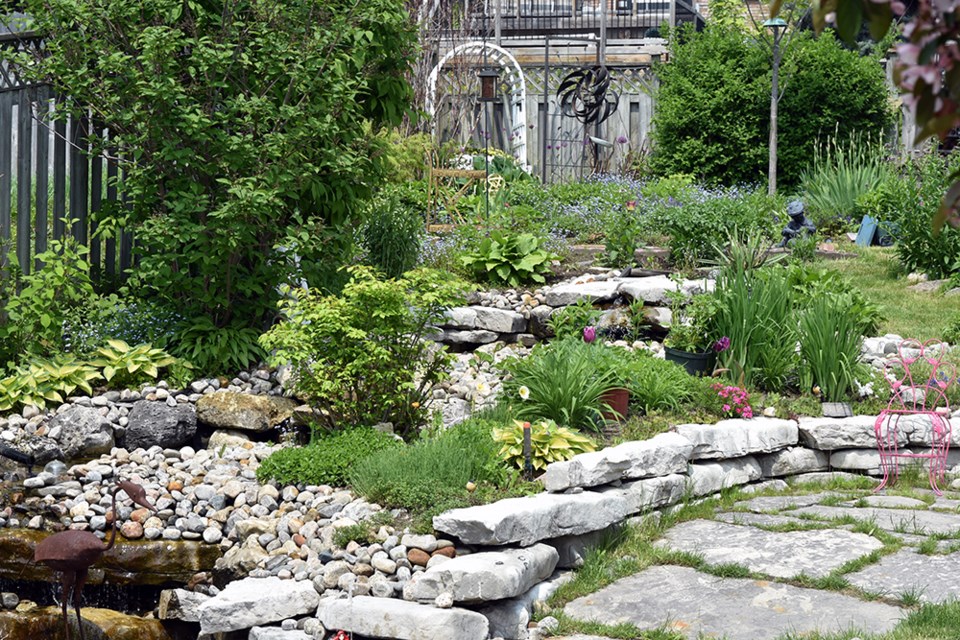 Beautifully landscaped and planted backyard - a secret garden. Miriam King/Bradford Today