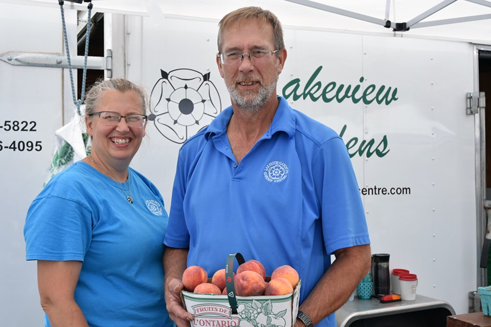 Rose and Rob Radcliffe of Lakeview Gardens with fresh Ontario-grown peaches. Miriam King/Bradford Today