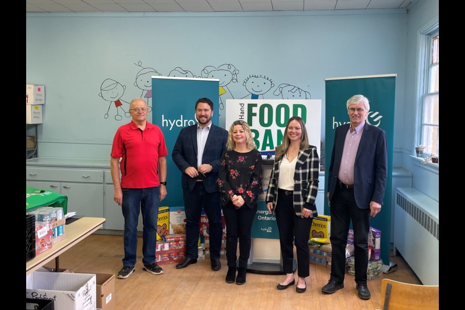 Jay Armitage, Hydro One's VP, Marketing and Communications was joined by Carolyn Khan, Executive Director of Helping Hand Food Bank, Mayor Rob Keffer, Councillor Jonathan Scott, and Bill Jermyn, VP of Helping Hand’s board to announce $25,000 in funding for the food bank.