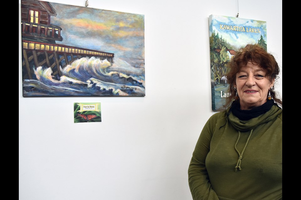 Artist Gayann Goucher, with artwork on display at the BWG Public Library. Miriam King/Bradford Today