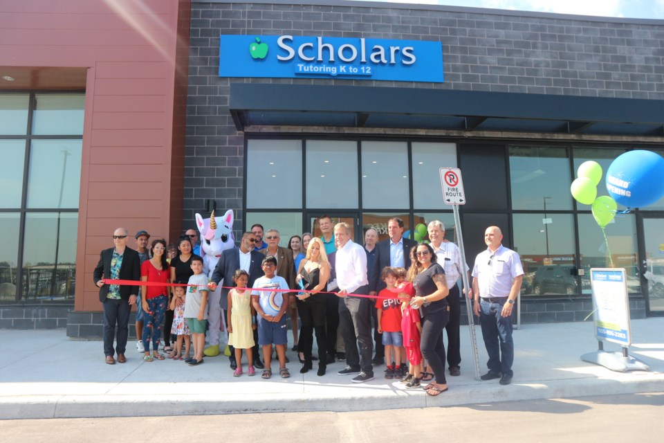 Members of council and the Bradford Board of Trade join John Wager and Risa Fine in the grand opening of their new business, Scholar's Education Centre in Bradford. Natasha Philpott/BradfordToday                               