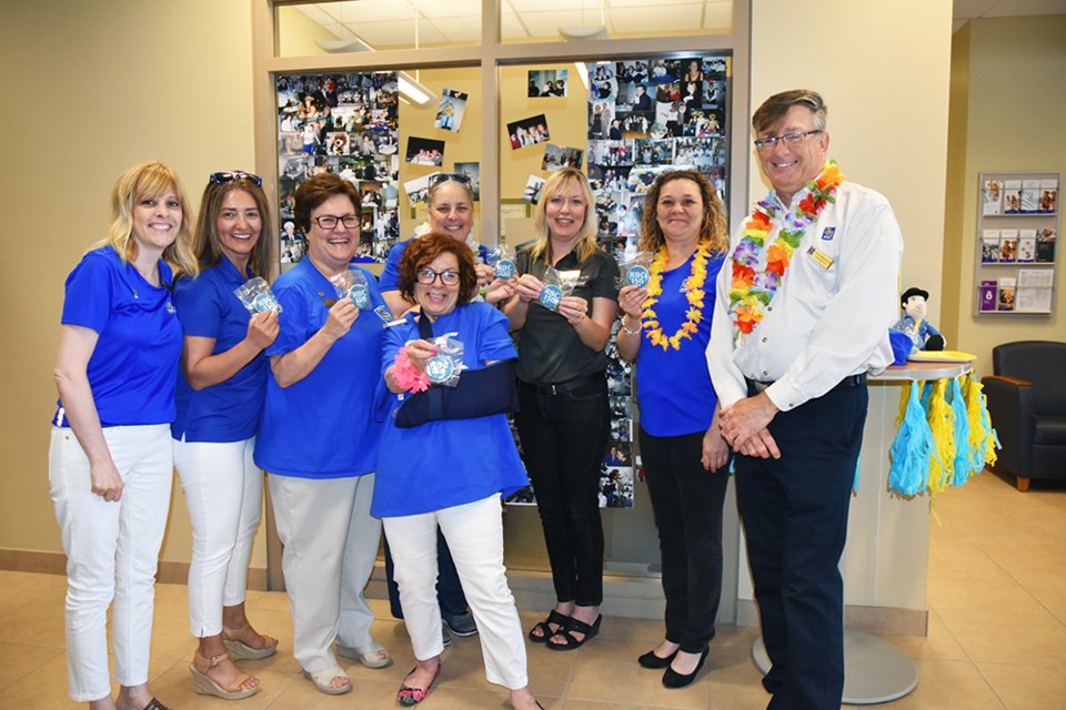 Wayne Brakeboer, right, and staff at the Bradford Branch, celebrating RBC's 150th. Miriam King/Bradford Today