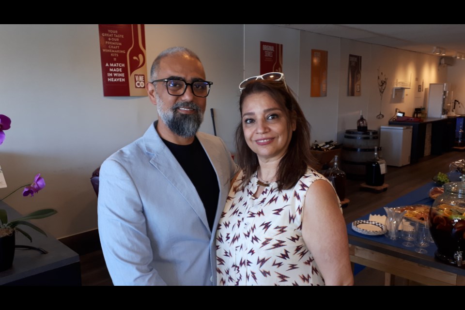 Amir Maroofi and his wife at the grand opening event on Saturday